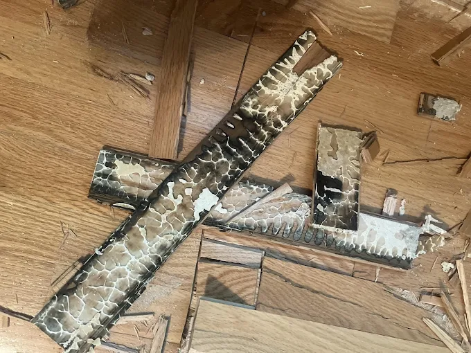 Water-damaged hardwood flooring torn out during restoration in Boerne
